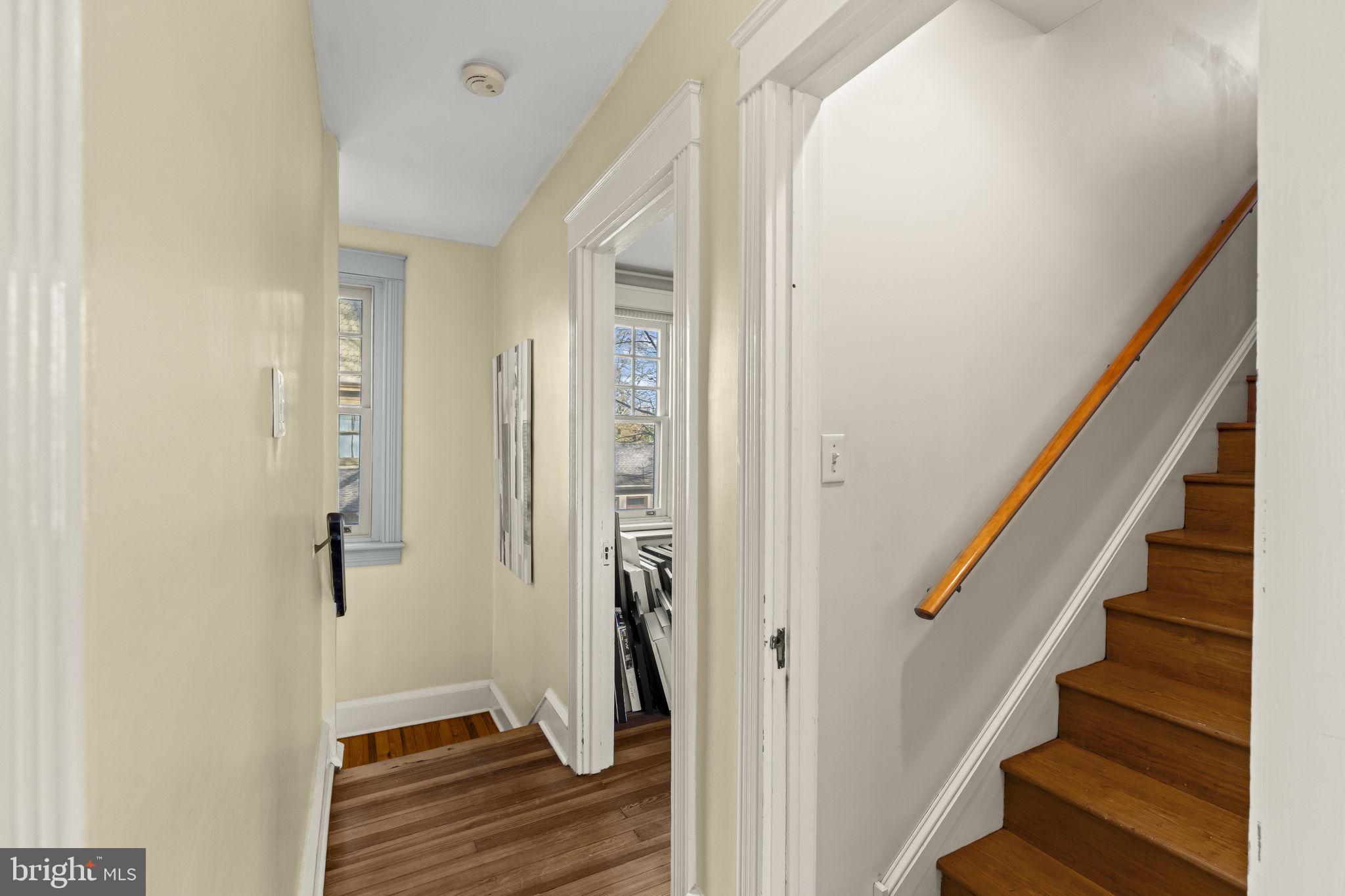 339 Park Avenue Swarthmore, PA 19081 - Photo 24 of 54 a view of a hallway with wooden floor and staircase