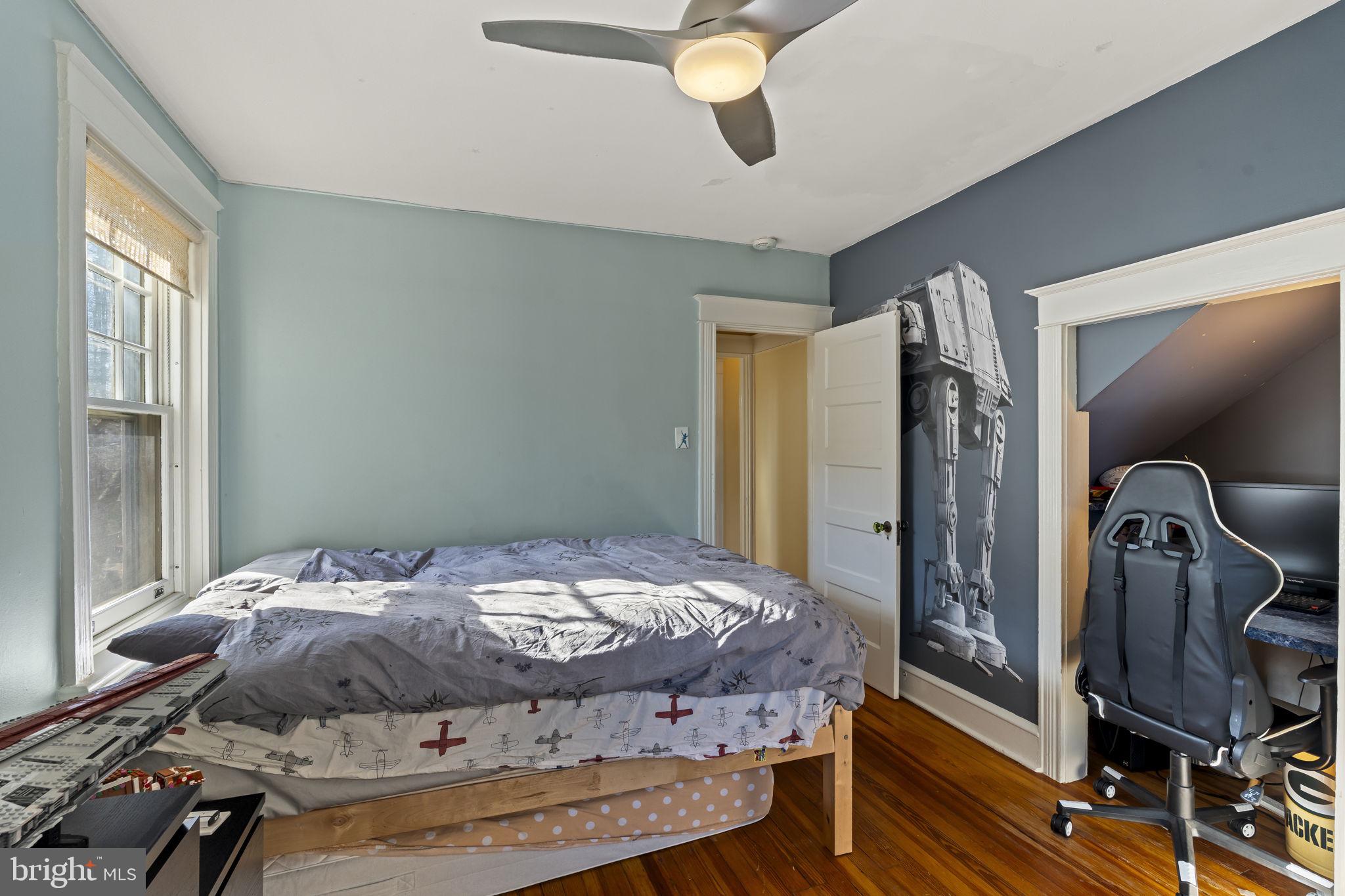 339 Park Avenue Swarthmore, PA 19081 - Photo 29 of 54 a bedroom with a bed and wooden floor