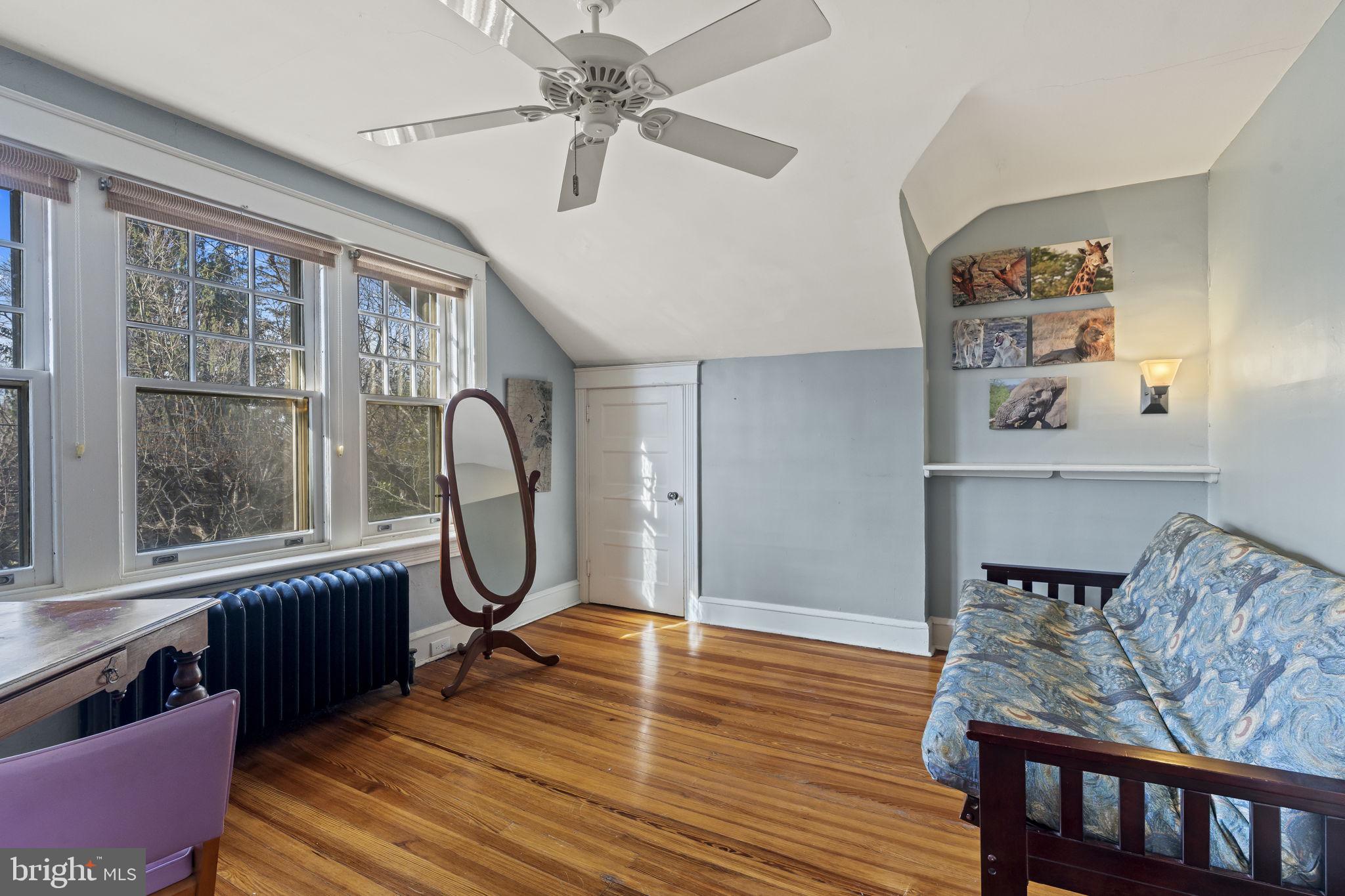 339 Park Avenue Swarthmore, PA 19081 - Photo 31 of 54 a living room with furniture a large window and wooden floor