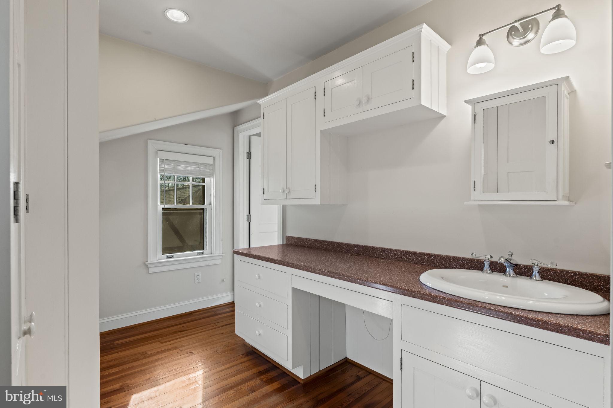 339 Park Avenue Swarthmore, PA 19081 - Photo 39 of 54 a bathroom with a sink and a mirror