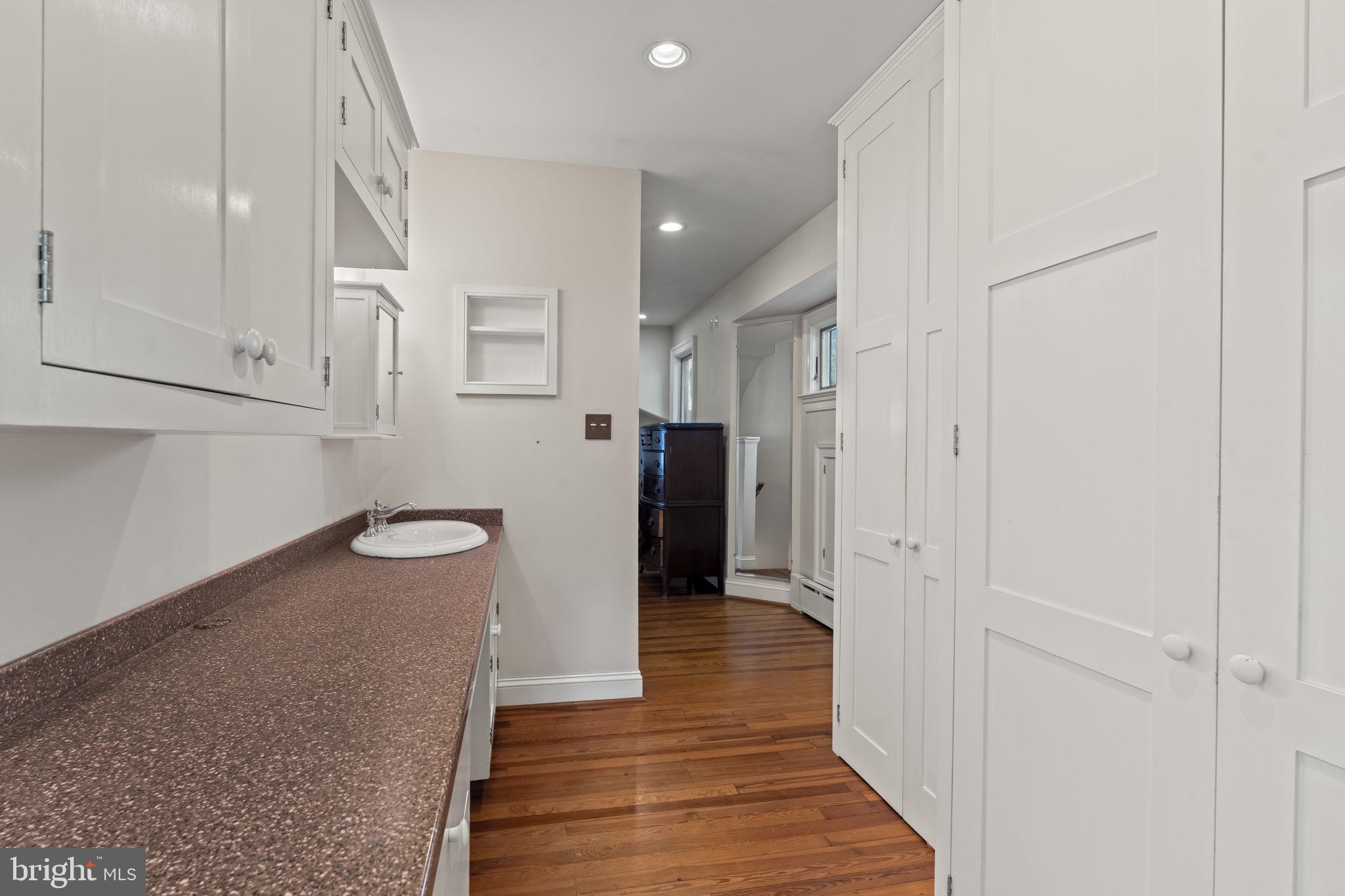 339 Park Avenue Swarthmore, PA 19081 - Photo 40 of 54 a view of a hallway with wooden floor