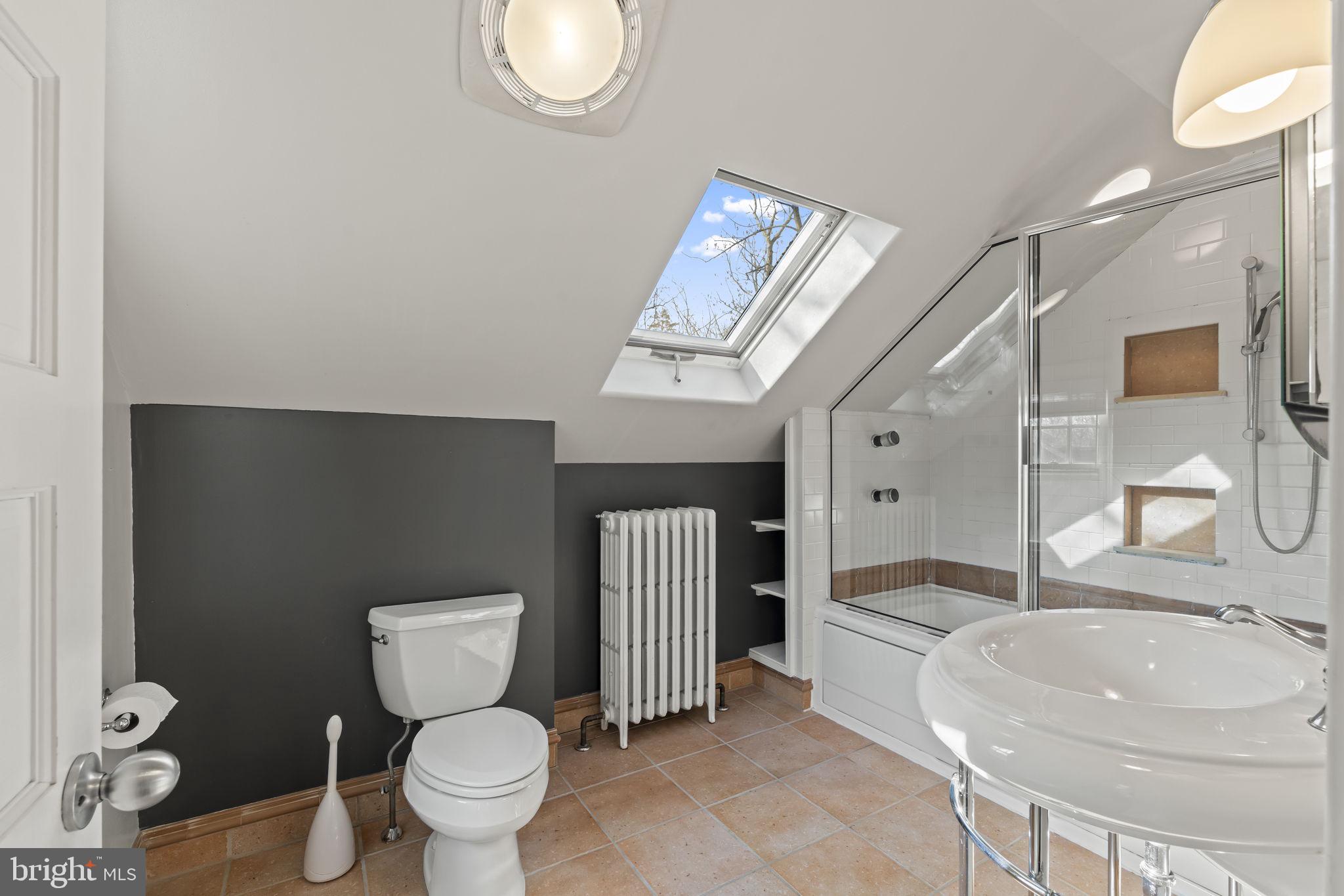 339 Park Avenue Swarthmore, PA 19081 - Photo 41 of 54 a bathroom with a granite countertop toilet sink mirror vanity and shower