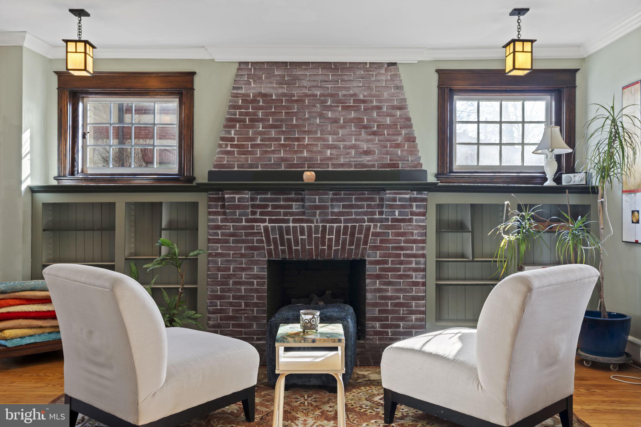 339 Park Avenue Swarthmore, PA 19081 - Photo 8 of 54 a living room with furniture a window and a fireplace