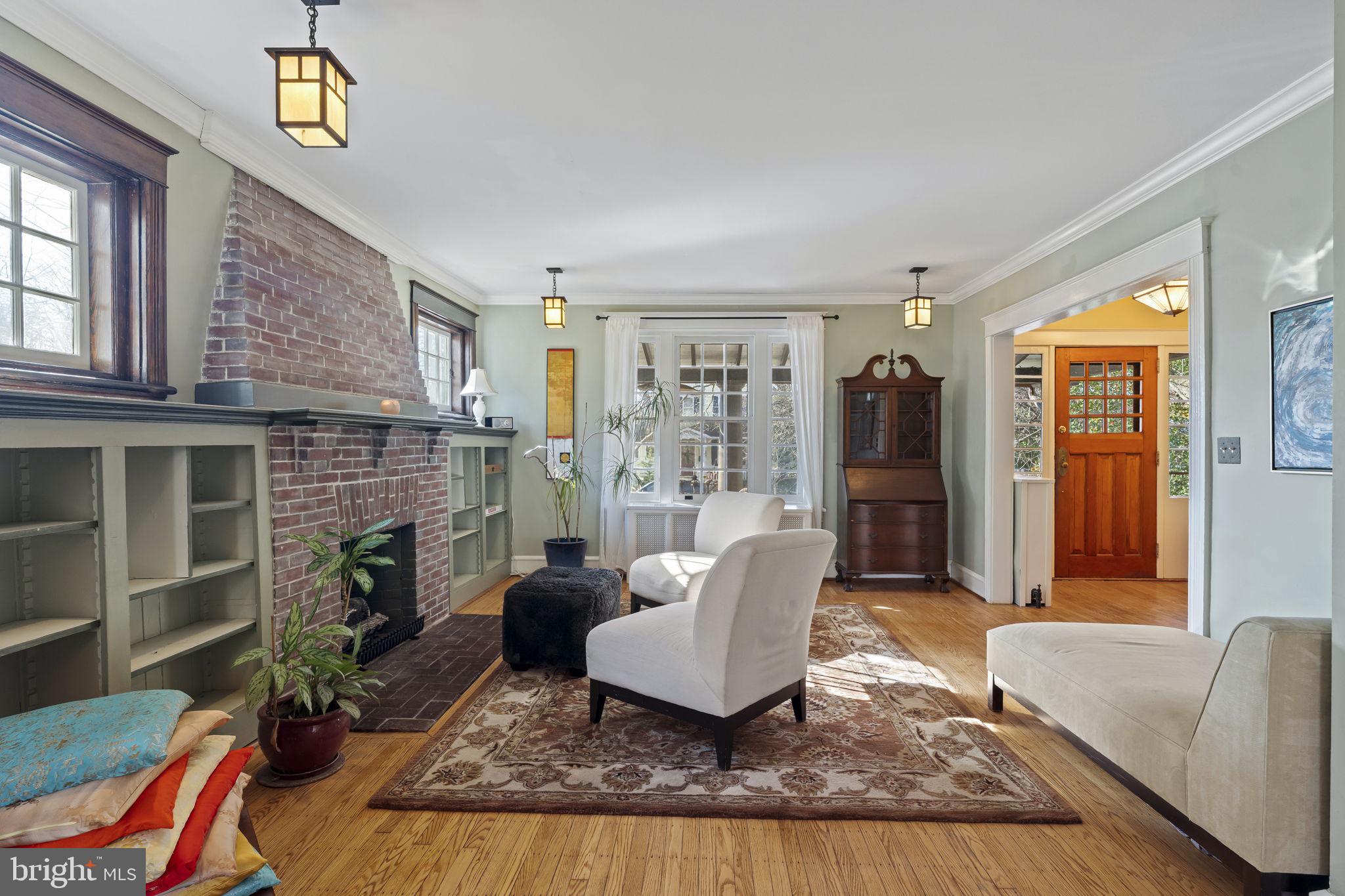 339 Park Avenue Swarthmore, PA 19081 - Photo 9 of 54 a living room with furniture and a fireplace