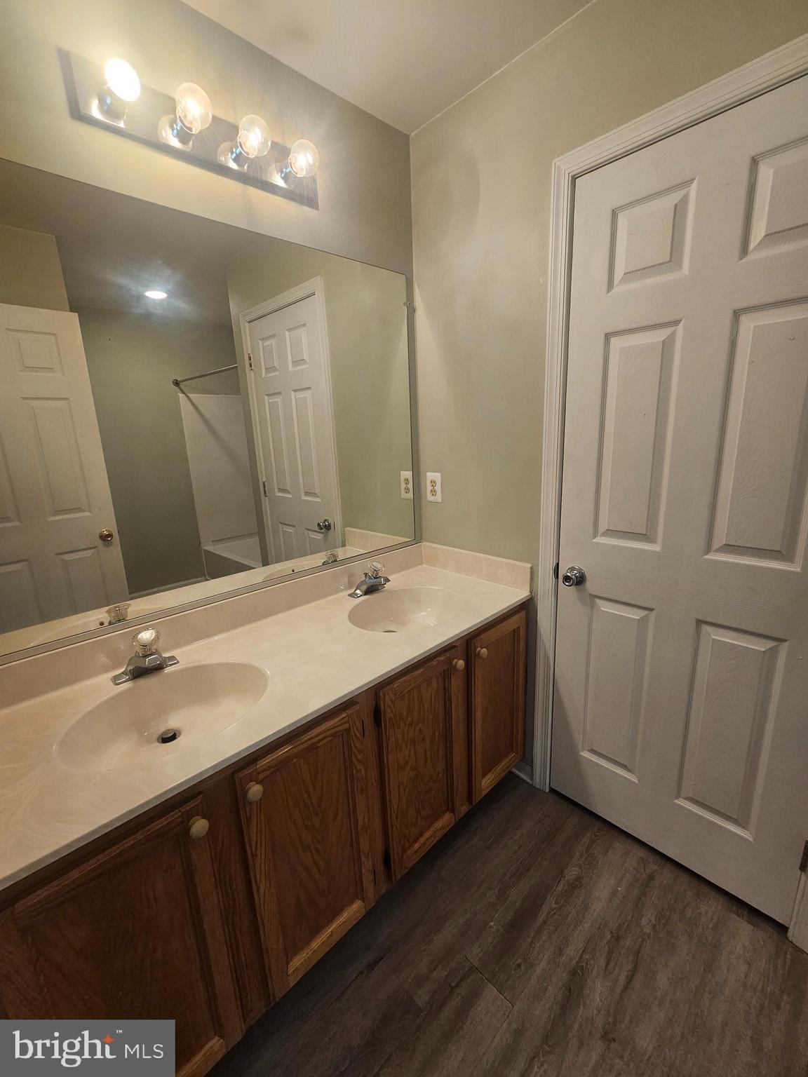 13 Denny Circle Newark, DE 19702 - Photo 12 of 18 a bathroom with a double vanity sink and a mirror