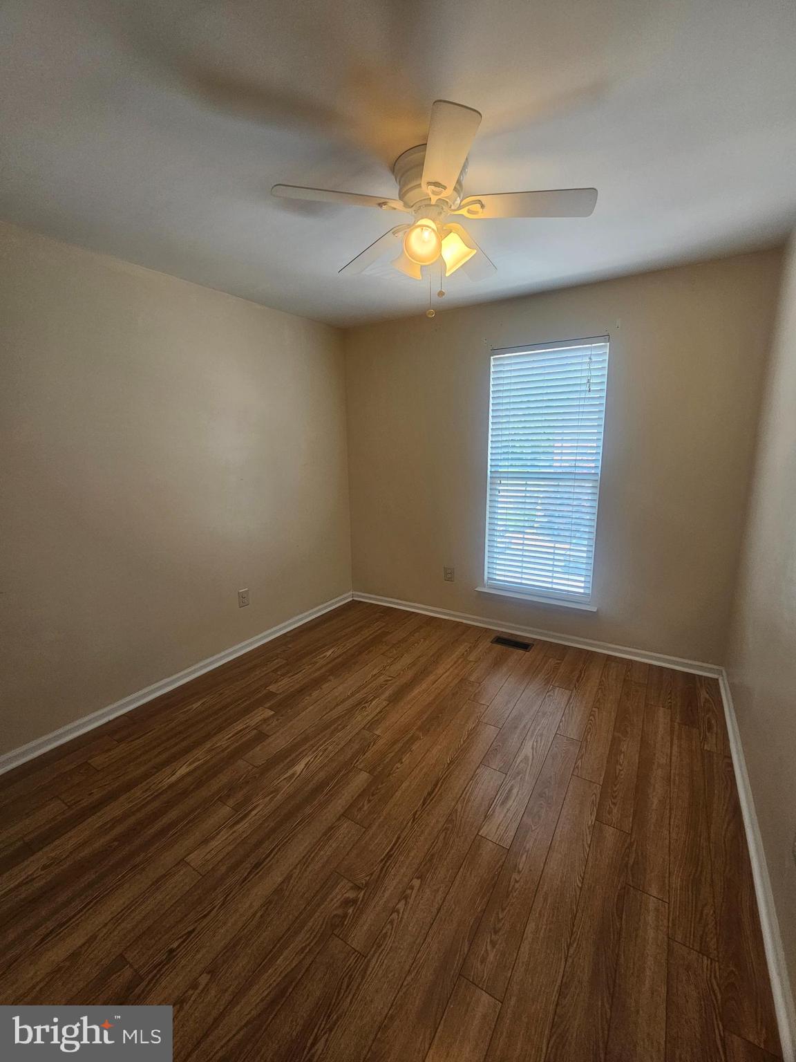 13 Denny Circle Newark, DE 19702 - Photo 15 of 18 an empty room with wooden floor and windows