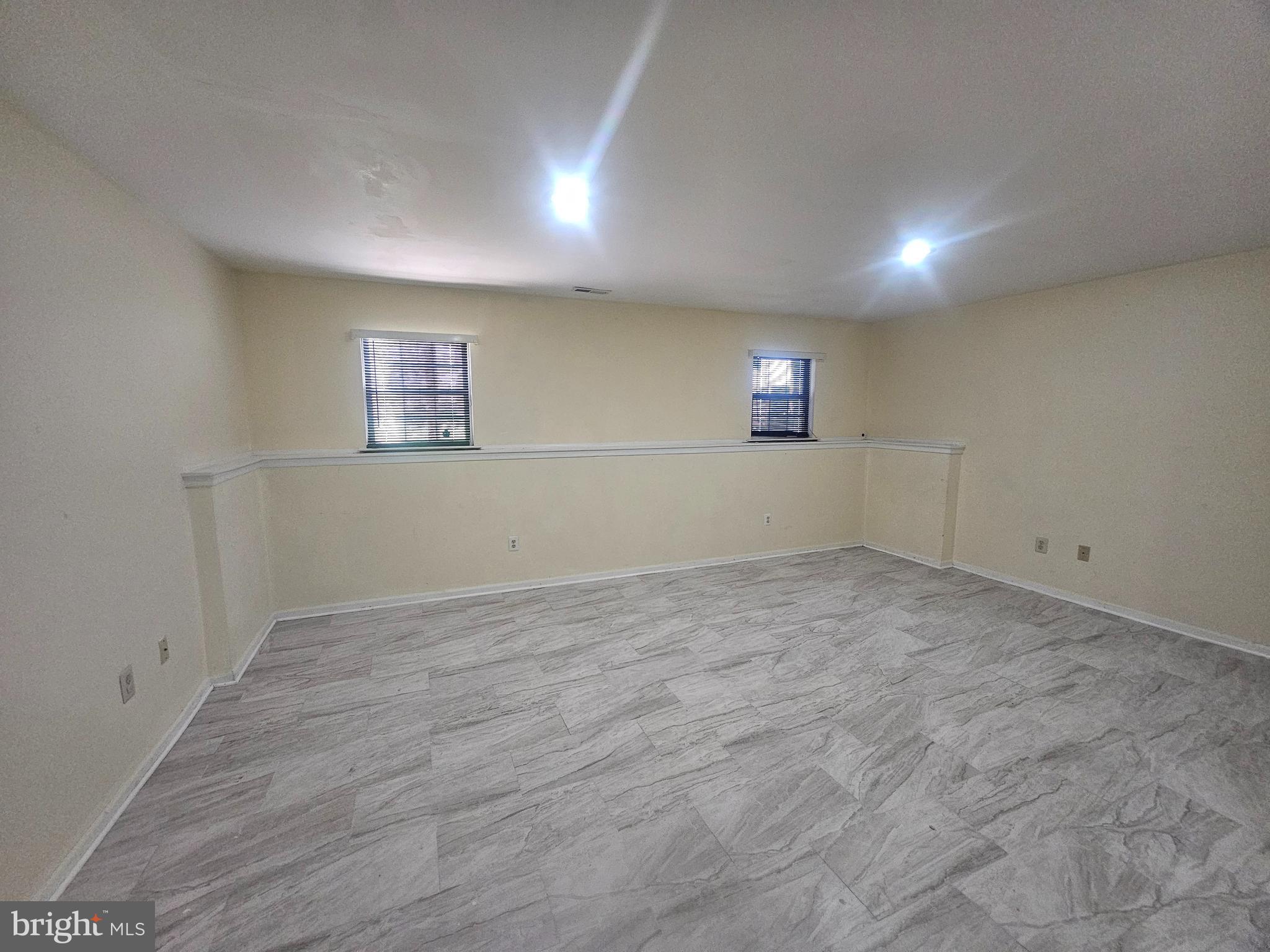 13 Denny Circle Newark, DE 19702 - Photo 17 of 18 an empty room with a empty space and windows