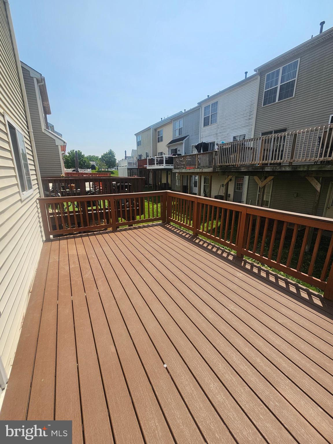 13 Denny Circle Newark, DE 19702 - Photo 3 of 18 a view of balcony with wooden floor and city view