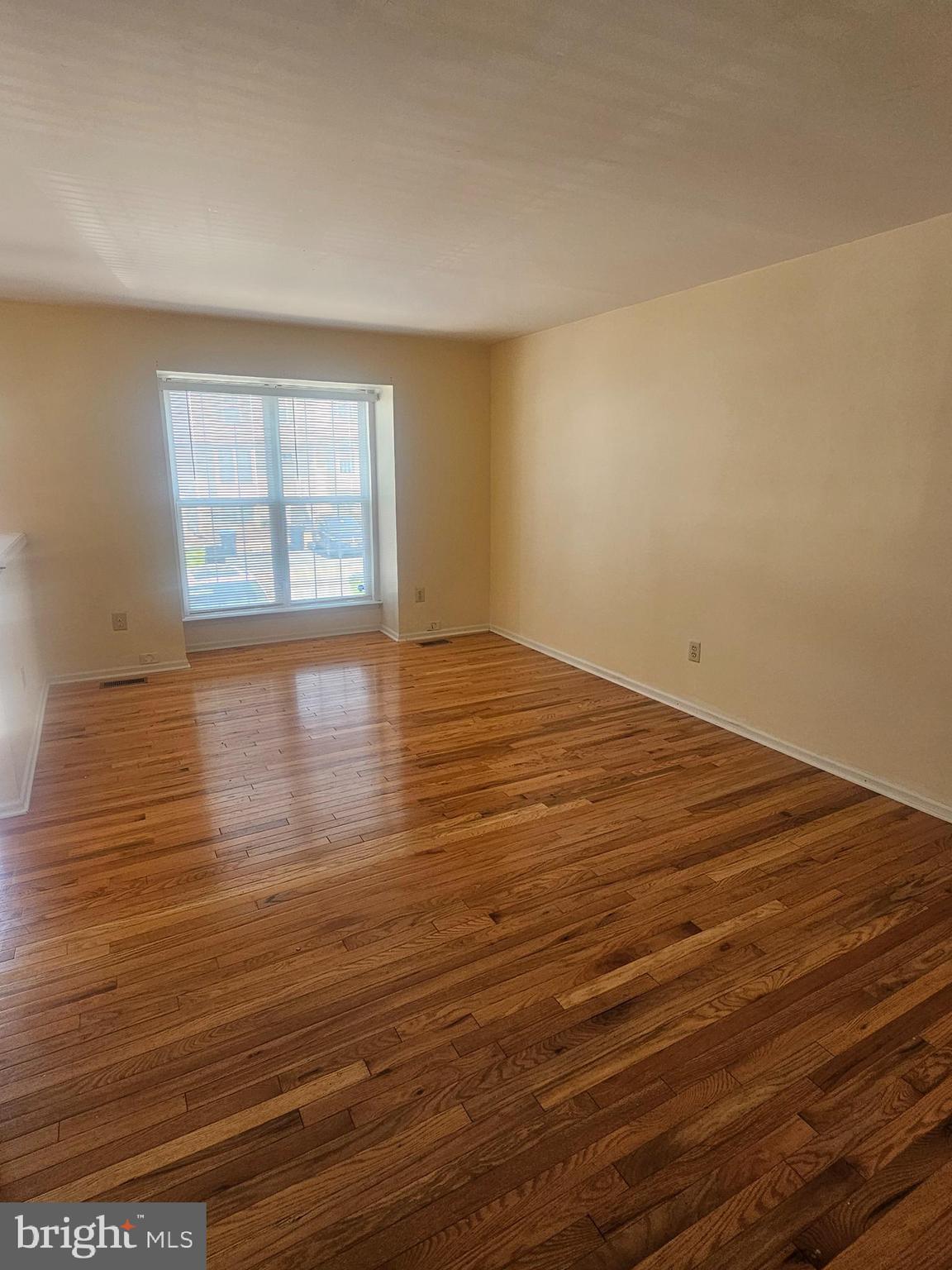13 Denny Circle Newark, DE 19702 - Photo 4 of 18 wooden floor in an empty room with a window