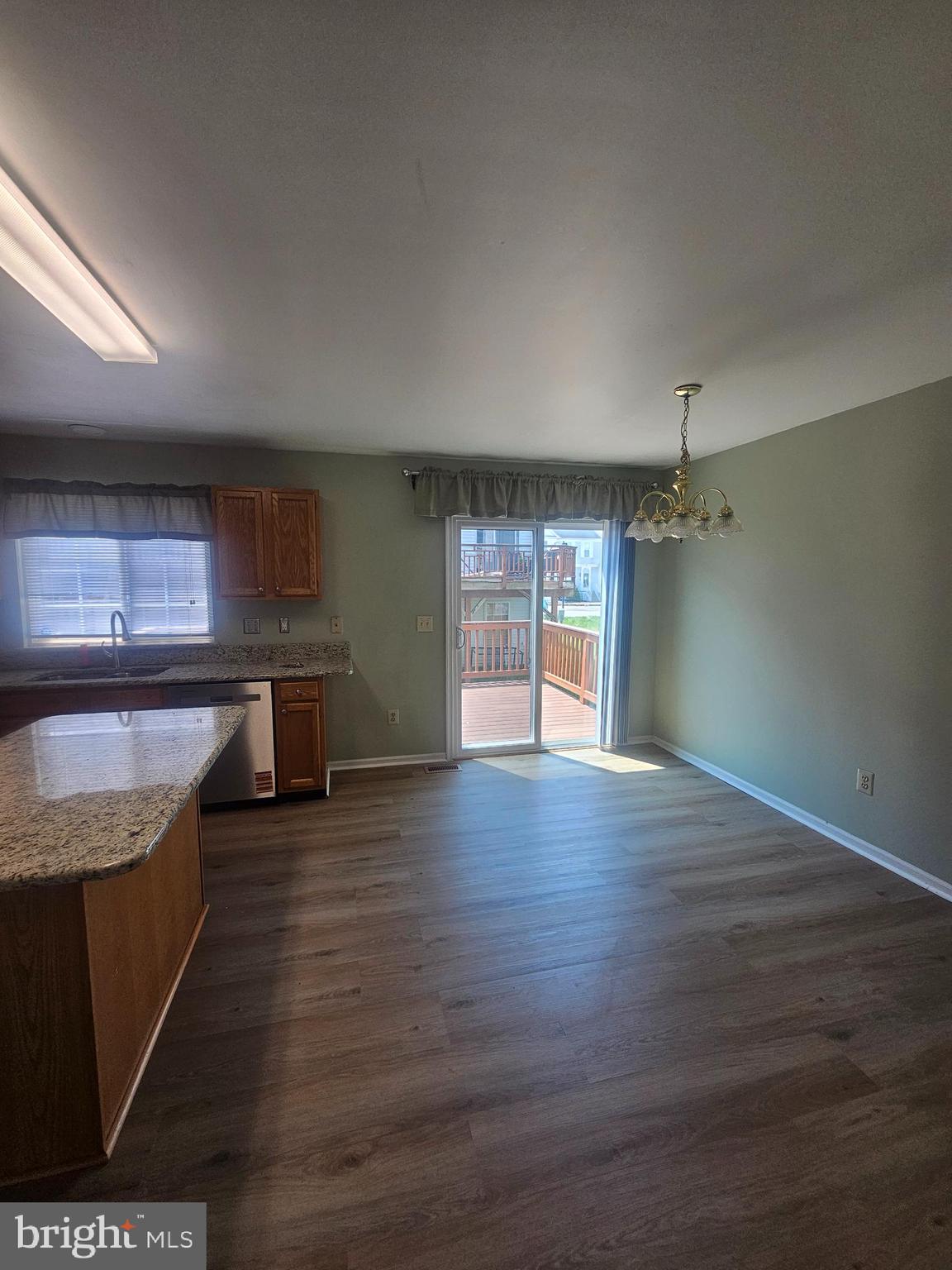 13 Denny Circle Newark, DE 19702 - Photo 5 of 18 an empty room with wooden floor and entrance