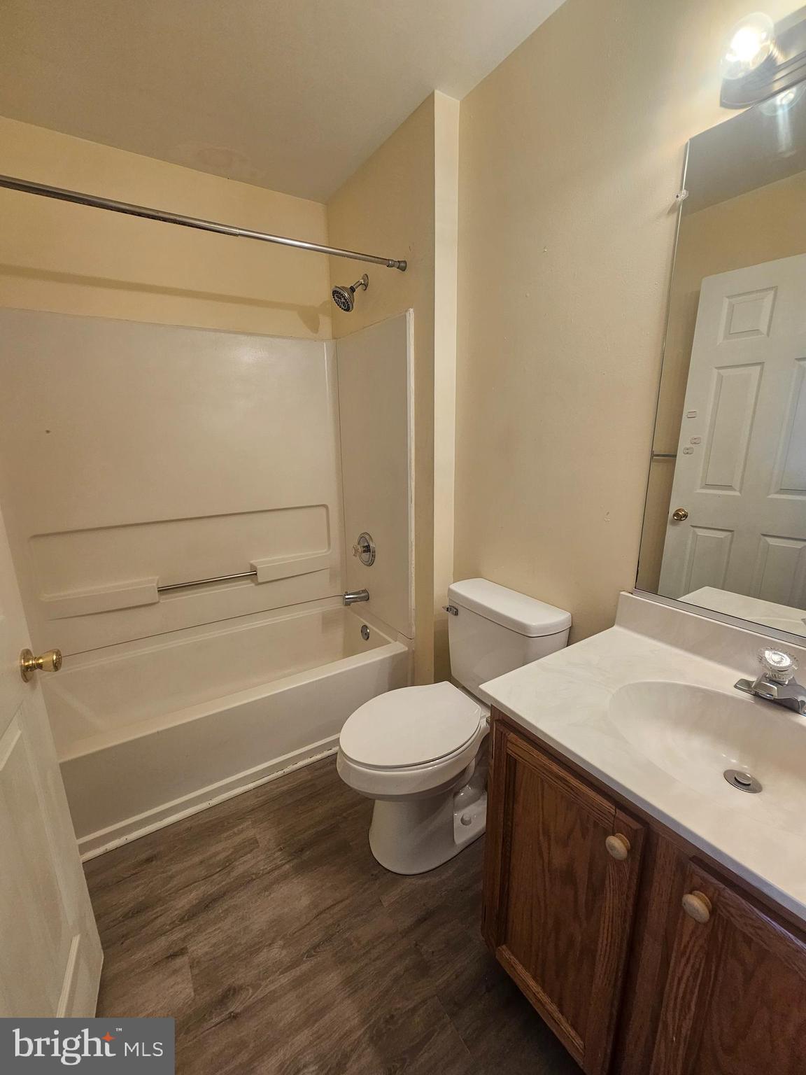 13 Denny Circle Newark, DE 19702 - Photo 8 of 18 a bathroom with a sink a toilet and shower