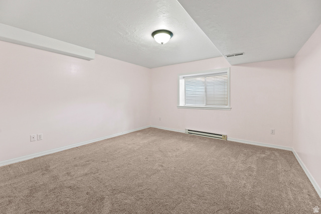 4668 Bountiful Ridge Drive Bountiful, UT 84010 - Photo 24 of 37 Carpeted room featuring a window with blinds, ceiling-mounted light fixture, and baseboard heating