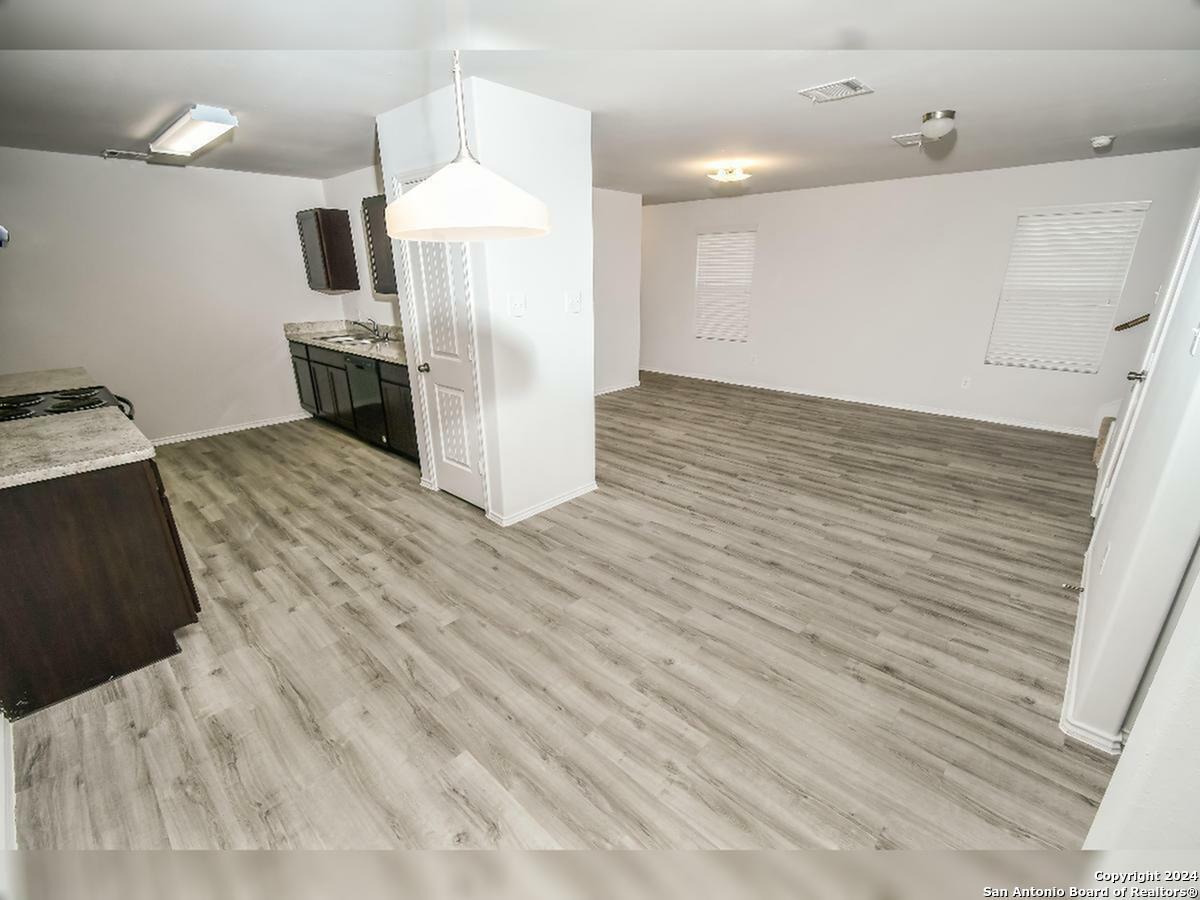 10506 Apple Pie Road San Antonio, TX 78224 - Photo 5 of 14 a view of kitchen view with wooden floor