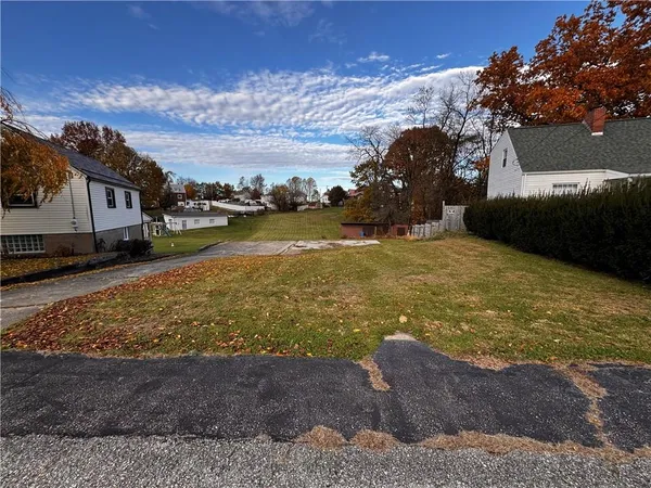 a view of a yard with an ocean view