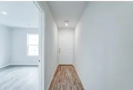 a view of a bathroom from a hallway