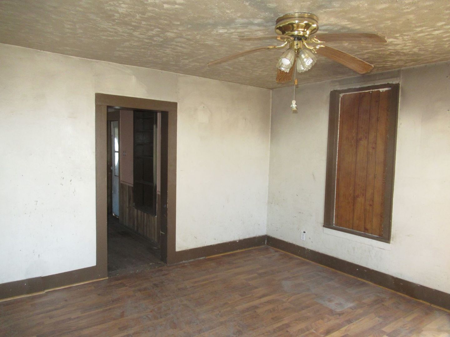 3560 North 2100E Road Ludlow, IL 60949 - Photo 16 of 22 an empty room that has a chandelier fan and wooden floor