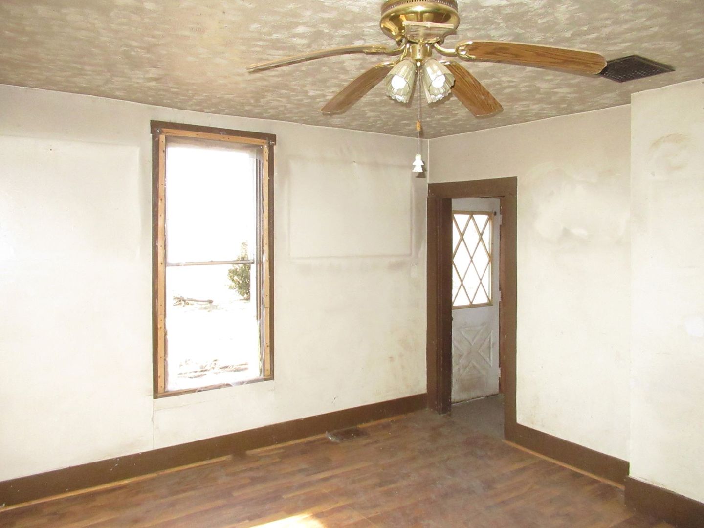 3560 North 2100E Road Ludlow, IL 60949 - Photo 17 of 22 an empty room with a windows and chandelier fan
