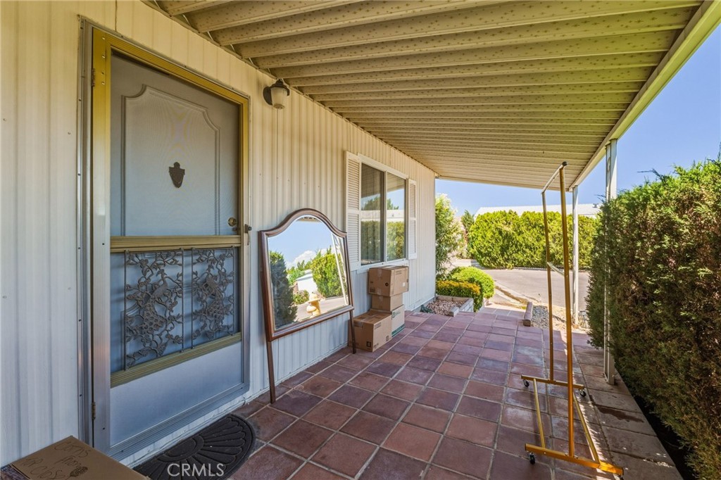20683 Waalew Road, Unit B201 Apple Valley, CA 92307 - Photo 3 of 32 a view of a porch and garden