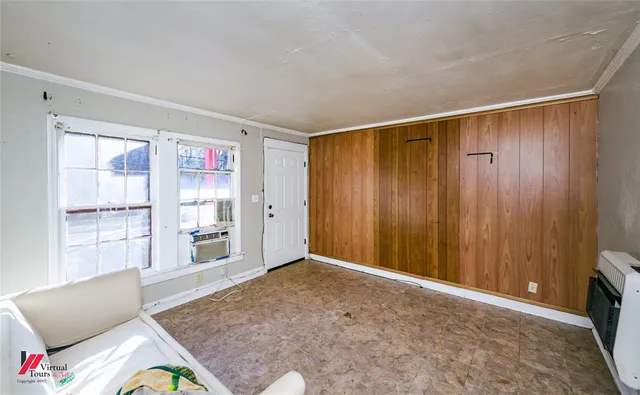 a view of an empty room and window