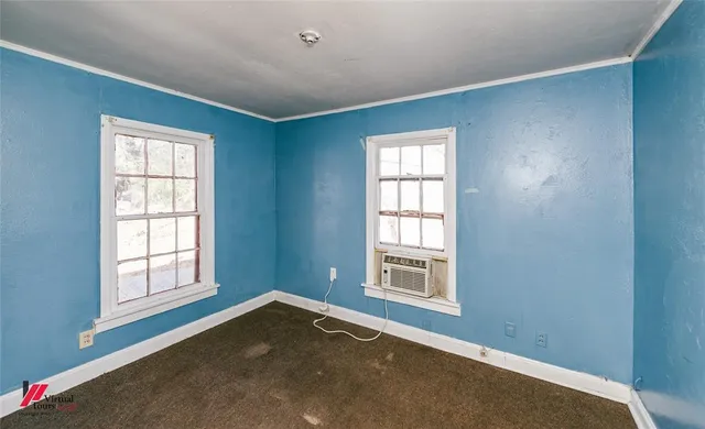 an empty room with windows