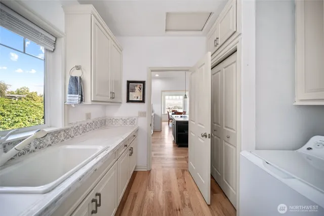 a kitchen with a sink and refrigerator
