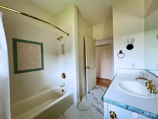 a bedroom with a bed and a mirror