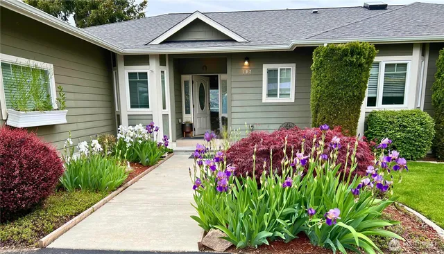 a front view of a house with a yard