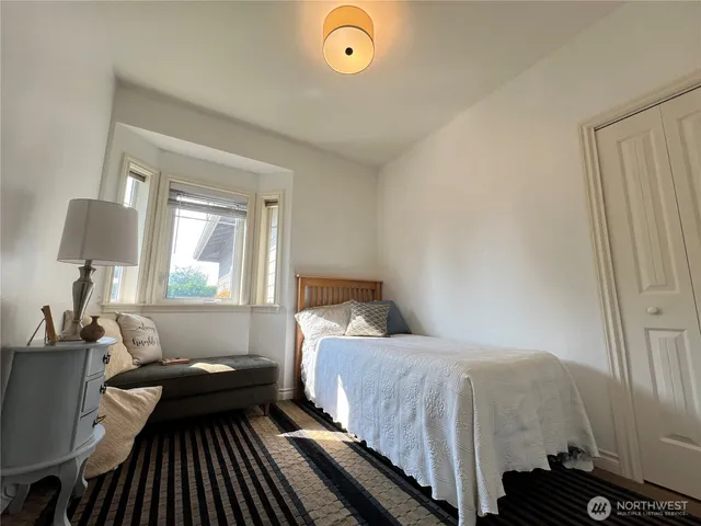 a view of a patio with table and chairs and potted plants