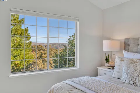 a bathroom with a sink mirror and a shower