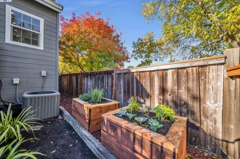 an aerial view of a house with a yard and outdoor seating