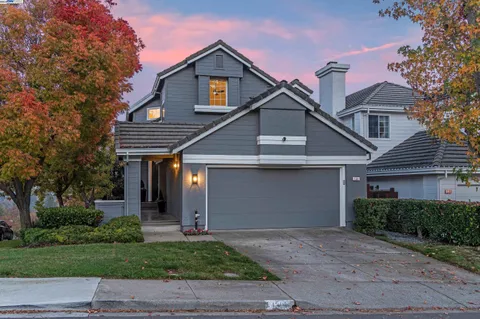 a view of a roof deck with table and chairs and wooden floor