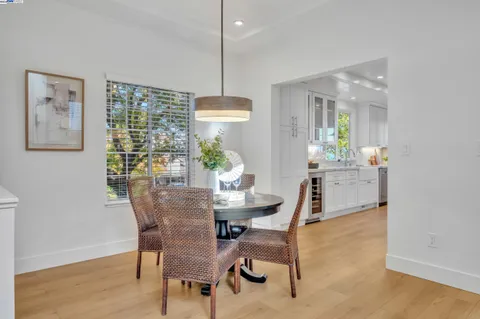 a kitchen with a sink a refrigerator and window