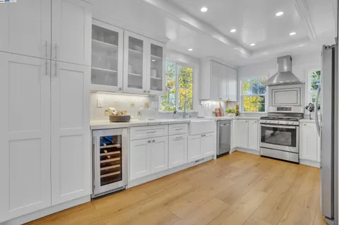 a kitchen with a sink cabinets and window