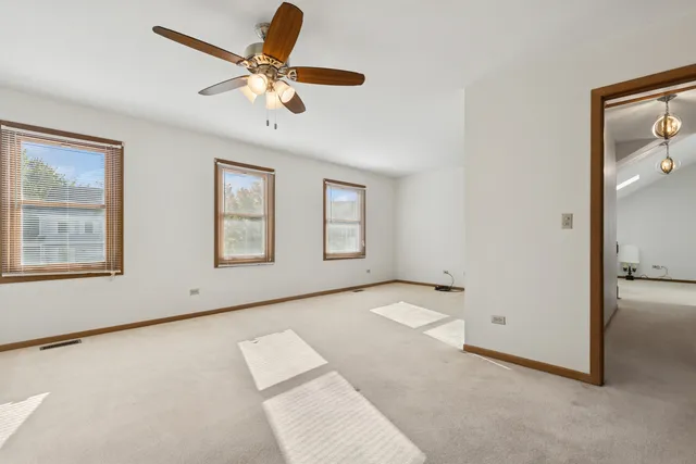a bathroom with a sink toilet vanity and shower