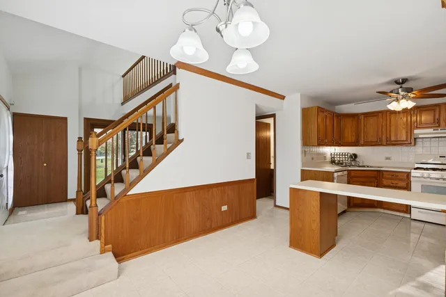 a kitchen with a sink cabinets and appliances