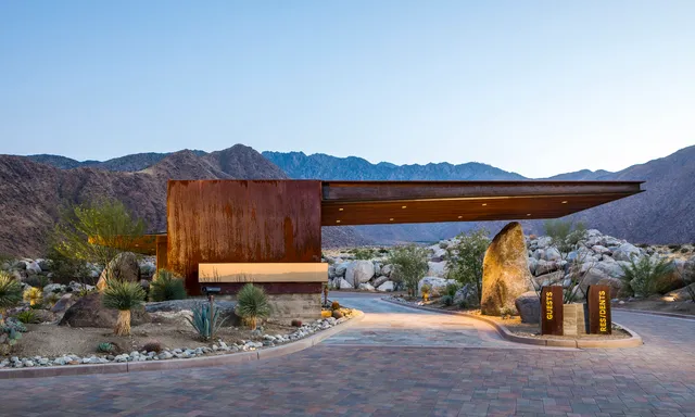 an outdoor sitting area with a fireplace