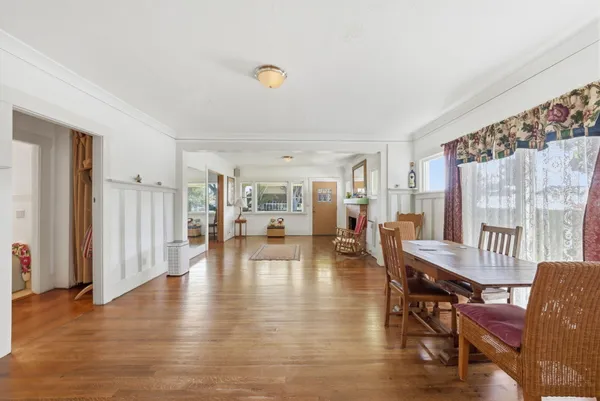 a view of a livingroom with furniture and wooden floor