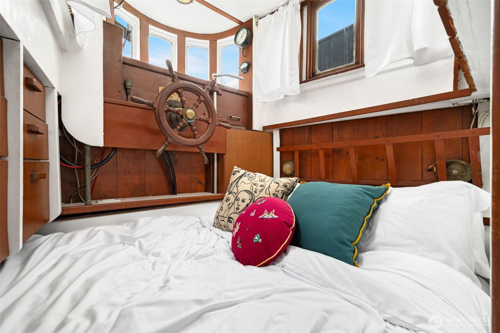 2143 North Northlake Way, Unit 34 Seattle, WA 98103 - Photo 12 of 21 a bedroom with a bed and a painting on the wall