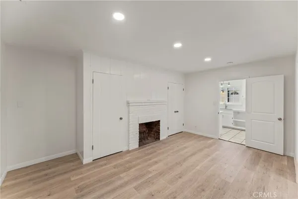 a bathroom with a tub double sink and mirror