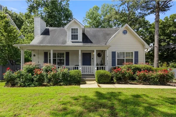 a front view of a house with garden