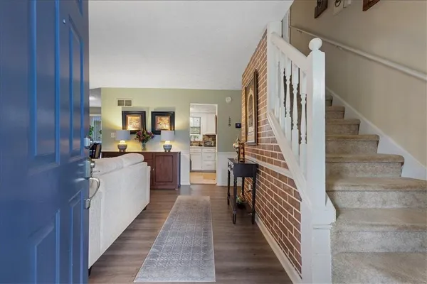a kitchen with sink cabinets and wooden floor