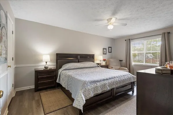 a bedroom with a bed and window