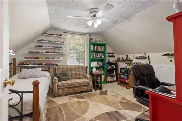 a bedroom with furniture and a gym