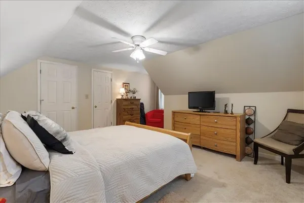 a bedroom with a bed and furniture