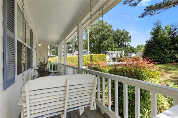 a view of balcony with furniture