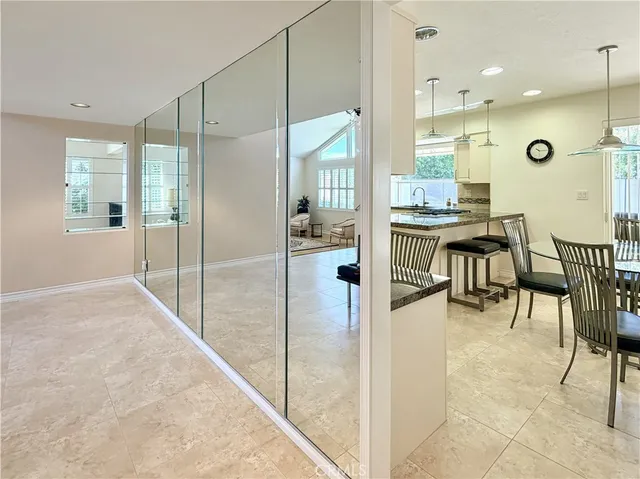 a large kitchen with a table and chairs