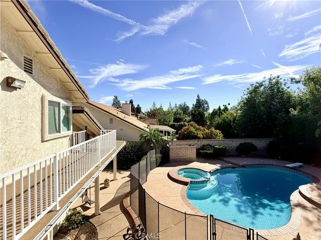 a balcony with table and chairs