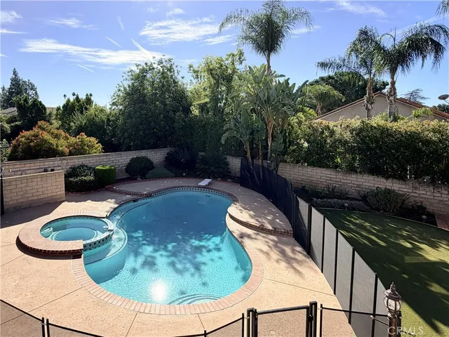 a swimming pool with outdoor seating