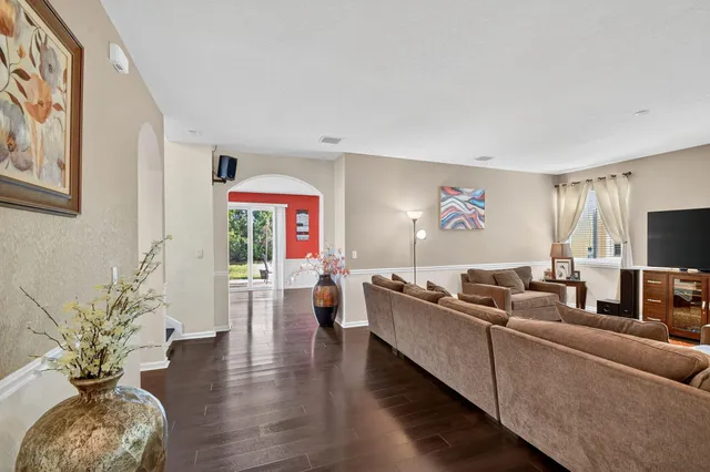 a kitchen with kitchen island a large counter top space appliances and cabinets