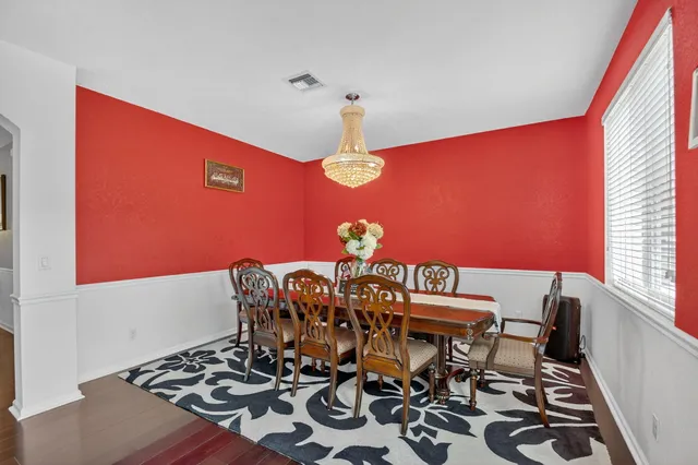 a bedroom with a bed and a dresser in it